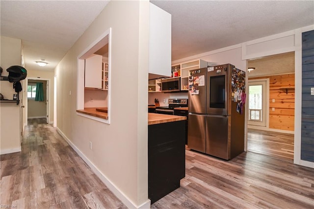 2813 Squire Ct, Chesapeake, VA 23323 - kitchen featuring appliances with stainless steel finishes, wooden counters, wood finished floors, open shelves, and healthy amount of natural light