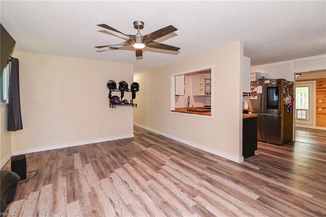 2813 Squire Ct, Chesapeake, VA 23323 - unfurnished living room with wood finished floors, ceiling fan, and a textured ceiling