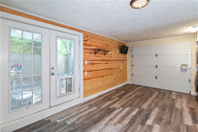 2813 Squire Ct, Chesapeake, VA 23323 - doorway to outside with french doors, a textured ceiling, dark wood finished floors, and wooden walls