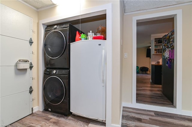 2813 Squire Ct, Chesapeake, VA 23323 - laundry room featuring estacked washer and dryer, wood finished floors, and ornamental molding