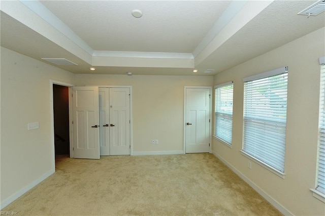 1604 Redwing Arch, Chesapeake, VA 23323 - unfurnished bedroom featuring a tray ceiling, light colored carpet, and recessed lighting