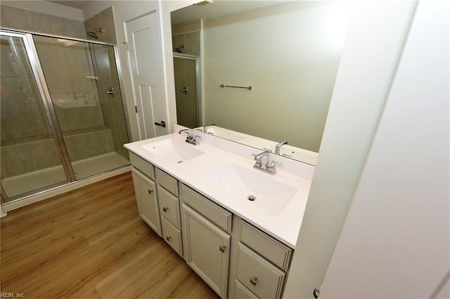1604 Redwing Arch, Chesapeake, VA 23323 - bathroom featuring a shower stall, double vanity, and wood finished floors