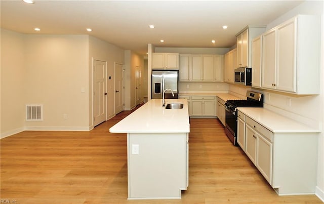 1604 Redwing Arch, Chesapeake, VA 23323 - kitchen featuring stainless steel appliances, recessed lighting, a center island with sink, light wood finished floors, and light countertops