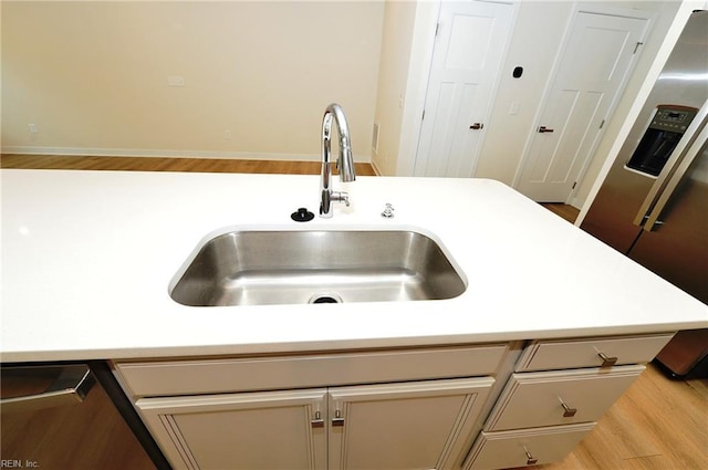 1604 Redwing Arch, Chesapeake, VA 23323 - kitchen with refrigerator with ice dispenser, light countertops, dishwasher, and wood finished floors