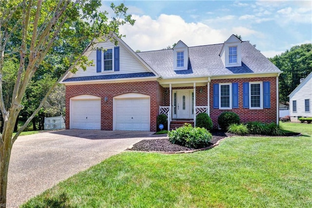 2712 Holly Ridge Ln, Williamsburg, VA 23185 - view of front facade featuring brick siding, concrete driveway, a front lawn, a shingled roof, and a garage