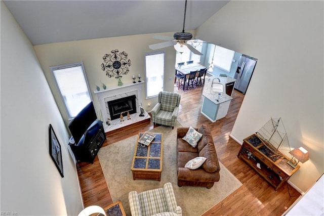 2712 Holly Ridge Ln, Williamsburg, VA 23185 - living area with healthy amount of natural light, wood finished floors, and high vaulted ceiling