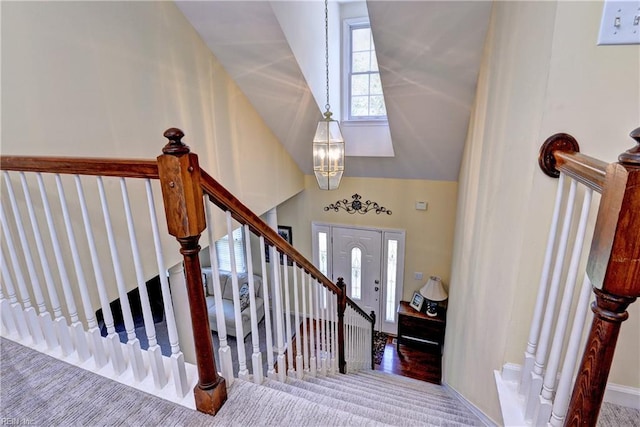 2712 Holly Ridge Ln, Williamsburg, VA 23185 - entryway featuring carpet, lofted ceiling, stairs, and a chandelier