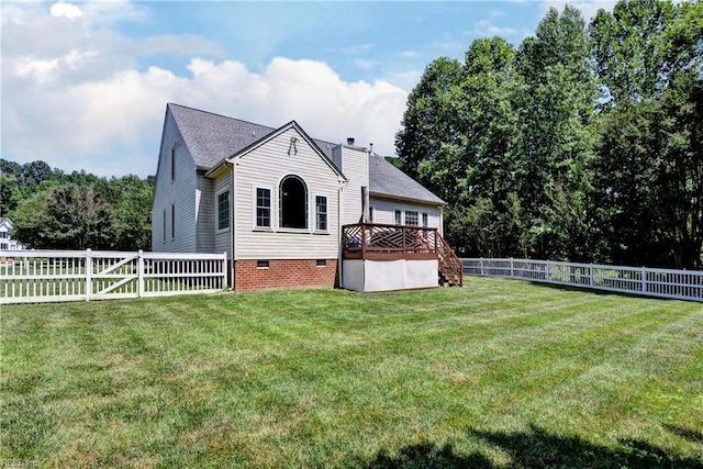 2712 Holly Ridge Ln, Williamsburg, VA 23185 - back of property with a fenced backyard, a deck, crawl space, and a chimney