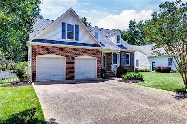 2712 Holly Ridge Ln, Williamsburg, VA 23185 - view of front of house featuring brick siding, roof with shingles, and driveway