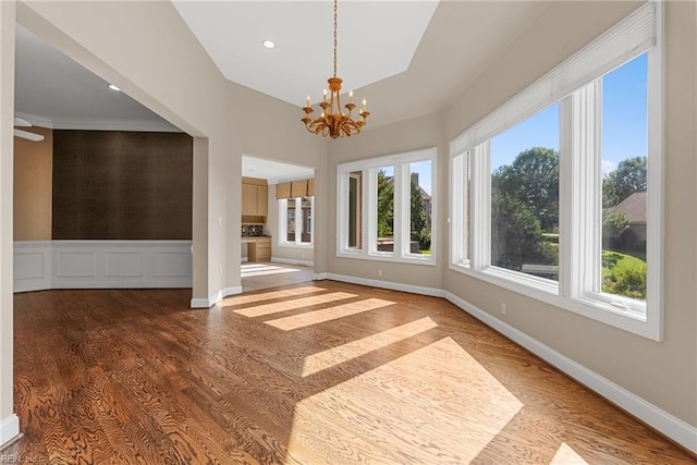 308 Rivers Edge, Williamsburg, VA 23185 - unfurnished room with a chandelier, wood finished floors, plenty of natural light, recessed lighting, and a towering ceiling