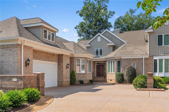 308 Rivers Edge, Williamsburg, VA 23185 - view of front facade featuring brick siding, decorative driveway, board and batten siding, and a shingled roof