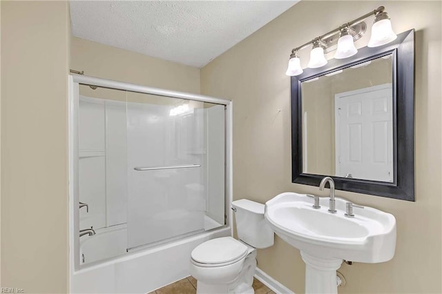4505 Wimbledon Way, Williamsburg, VA 23188 - full bathroom featuring a textured ceiling, bath / shower combo with glass door, and tile patterned floors