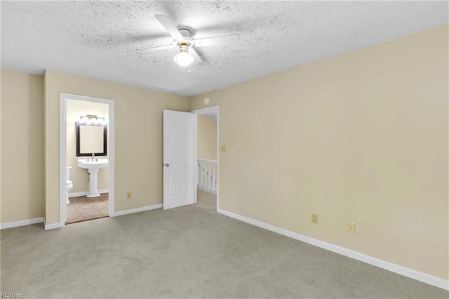 4505 Wimbledon Way, Williamsburg, VA 23188 - unfurnished bedroom featuring carpet, a textured ceiling, ensuite bath, and ceiling fan