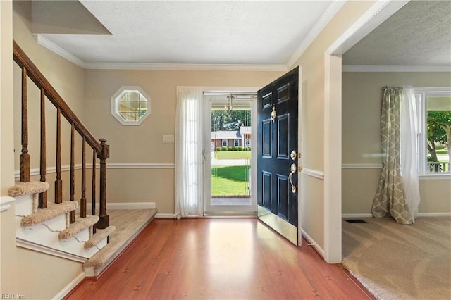 60 Dillwyn Dr, Newport News, VA 23602 - entrance foyer featuring stairs, a textured ceiling, wood finished floors, and ornamental molding