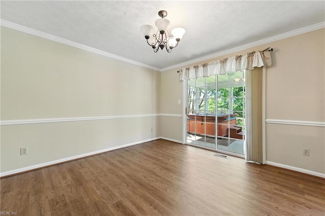60 Dillwyn Dr, Newport News, VA 23602 - spare room featuring a chandelier, wood finished floors, crown molding, and a textured ceiling