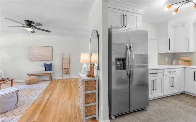 3048 John Hancock Dr, Virginia Beach, VA 23452 - kitchen with stainless steel fridge, light countertops, white cabinetry, a ceiling fan, and light wood finished floors