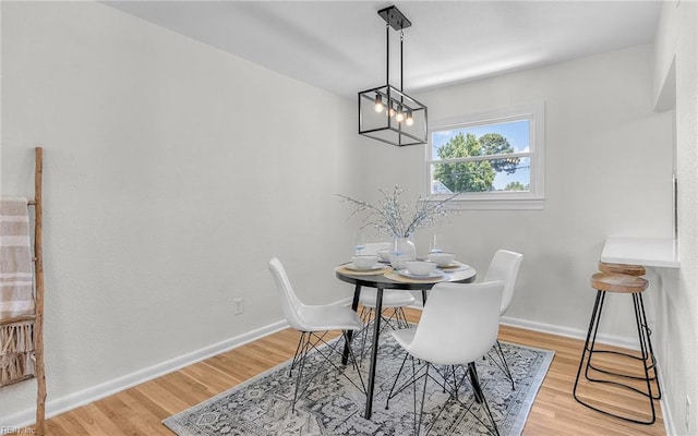 3048 John Hancock Dr, Virginia Beach, VA 23452 - dining area with a chandelier and wood finished floors