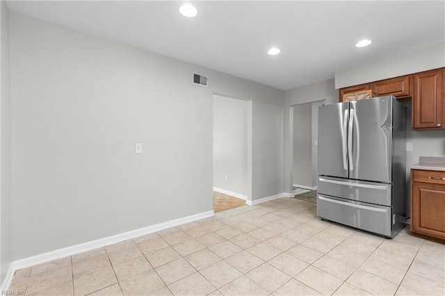 600 Whitechapel Dr, Virginia Beach, VA 23455 - kitchen featuring freestanding refrigerator, recessed lighting, brown cabinetry, and light countertops