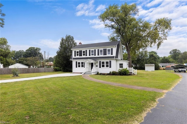 1507 Todds Ln, Hampton, VA 23666 - view of front of home featuring a storage shed, a chimney, and driveway