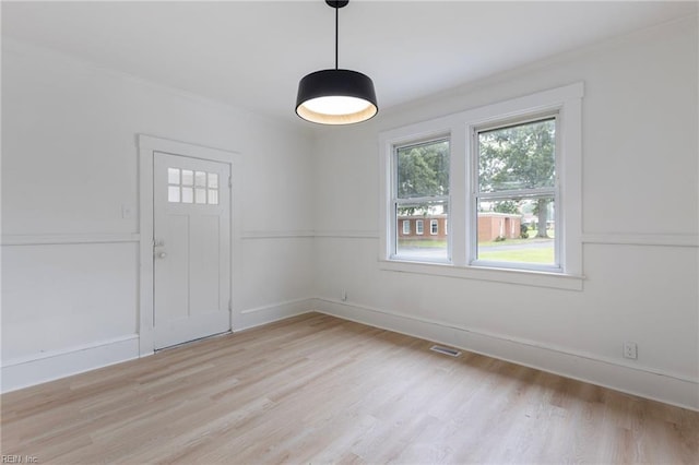 1507 Todds Ln, Hampton, VA 23666 - spare room featuring light wood-style flooring and ornamental molding