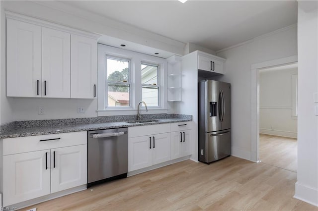 1507 Todds Ln, Hampton, VA 23666 - kitchen featuring stainless steel appliances, ornamental molding, light stone counters, white cabinets, and light wood-style flooring