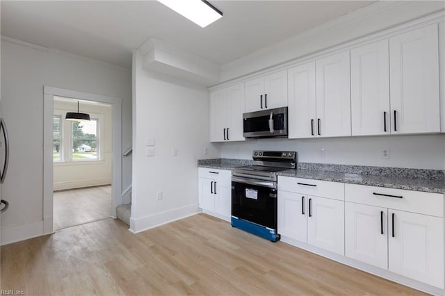 1507 Todds Ln, Hampton, VA 23666 - kitchen featuring appliances with stainless steel finishes, crown molding, light wood-type flooring, light stone counters, and white cabinets