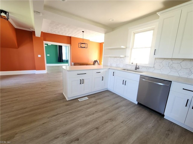110 S Willard Ave, Hampton, VA 23663 - kitchen with dishwasher, light wood finished floors, a peninsula, and tasteful backsplash