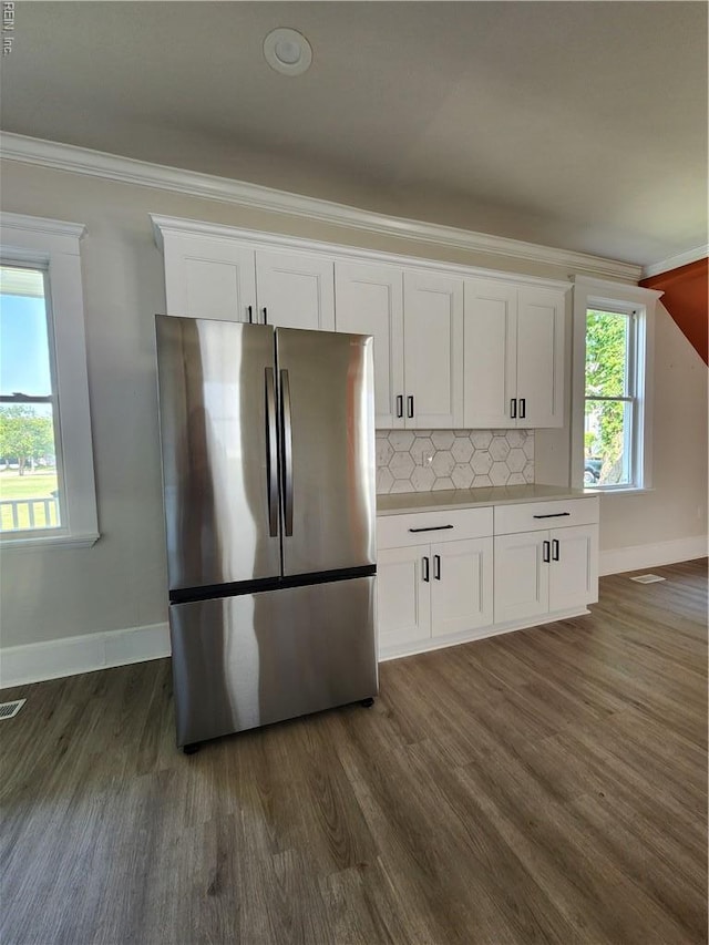 110 S Willard Ave, Hampton, VA 23663 - kitchen with freestanding refrigerator, ornamental molding, white cabinetry, dark wood finished floors, and backsplash