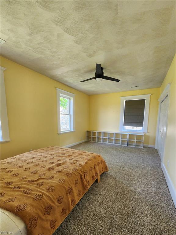 110 S Willard Ave, Hampton, VA 23663 - carpeted bedroom with baseboards and a ceiling fan