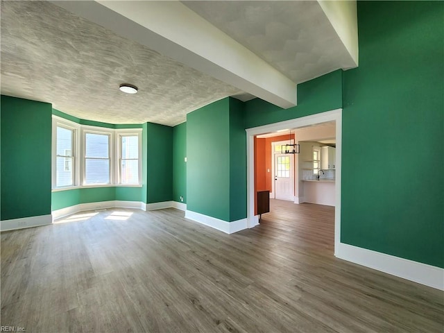 110 S Willard Ave, Hampton, VA 23663 - empty room with wood finished floors and a chandelier