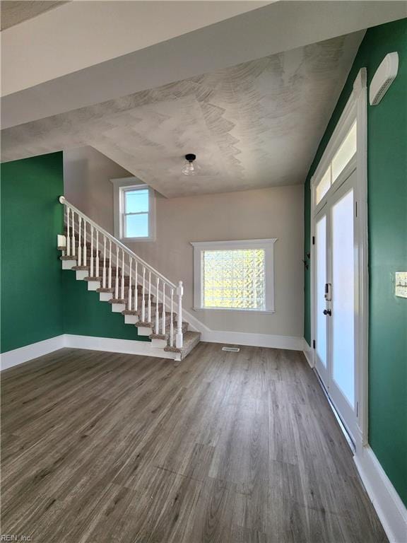 110 S Willard Ave, Hampton, VA 23663 - unfurnished living room with stairway and wood finished floors