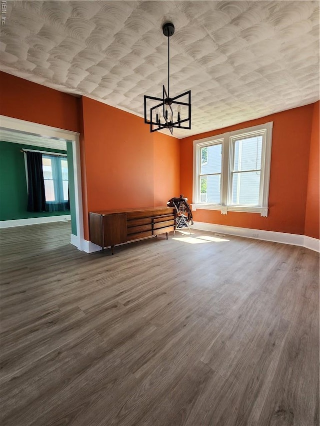 110 S Willard Ave, Hampton, VA 23663 - unfurnished dining area with wood finished floors and a chandelier