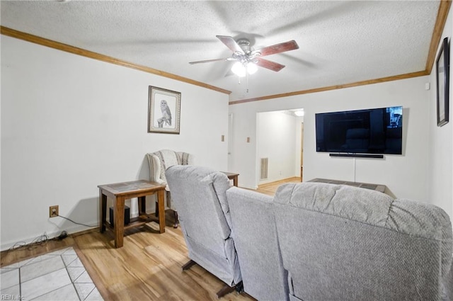 236 Haledon Rd, Chesapeake, VA 23320 - living room with crown molding, ceiling fan, a textured ceiling, and light tile patterned floors
