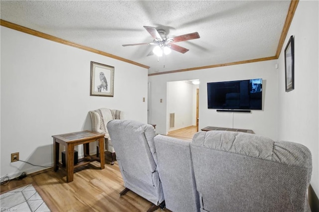 236 Haledon Rd, Chesapeake, VA 23320 - living area with crown molding, light wood-type flooring, ceiling fan, and a textured ceiling