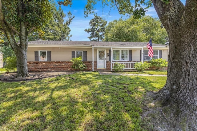 3009 Aaron Dr, Chesapeake, VA 23323 - ranch-style home featuring brick siding, a front lawn, and a porch
