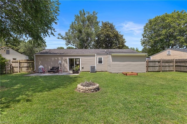 3009 Aaron Dr, Chesapeake, VA 23323 - back of property with a fire pit, a patio area, and a fenced backyard