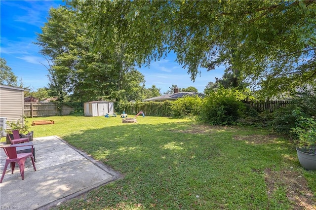 3009 Aaron Dr, Chesapeake, VA 23323 - fenced backyard with a storage shed, a patio, and a fire pit