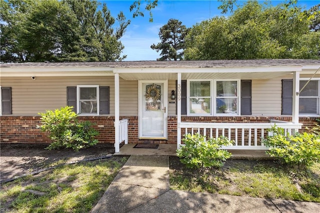 3009 Aaron Dr, Chesapeake, VA 23323 - view of front facade featuring a porch and brick siding