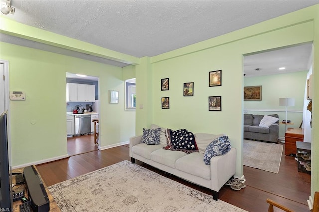 3009 Aaron Dr, Chesapeake, VA 23323 - living room with dark wood-style flooring, a textured ceiling, and recessed lighting