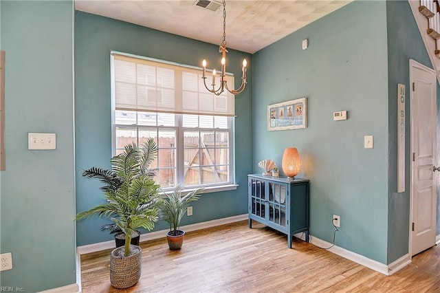 1212 Gunn Hall Dr, Virginia Beach, VA 23454 - dining area featuring a chandelier and wood finished floors