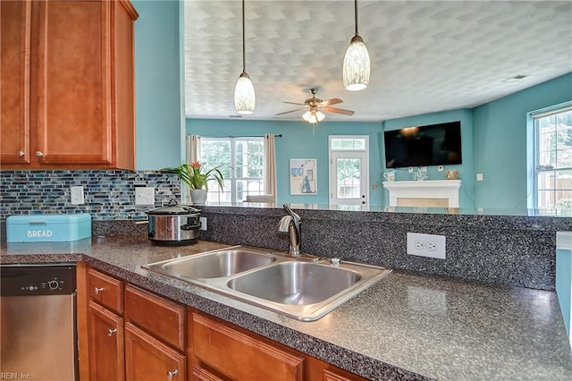 1212 Gunn Hall Dr, Virginia Beach, VA 23454 - kitchen featuring dishwasher, dark countertops, ceiling fan, brown cabinetry, and a textured ceiling