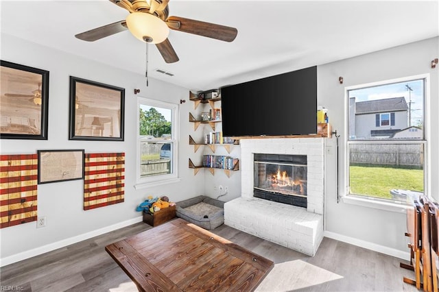 1536 Eagleton Ln, Virginia Beach, VA 23455 - living area with healthy amount of natural light, wood finished floors, a brick fireplace, and ceiling fan