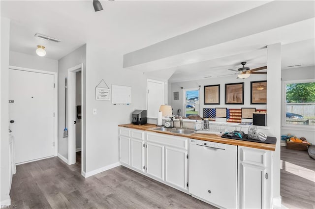 1536 Eagleton Ln, Virginia Beach, VA 23455 - kitchen with white dishwasher, wood counters, and white cabinetry
