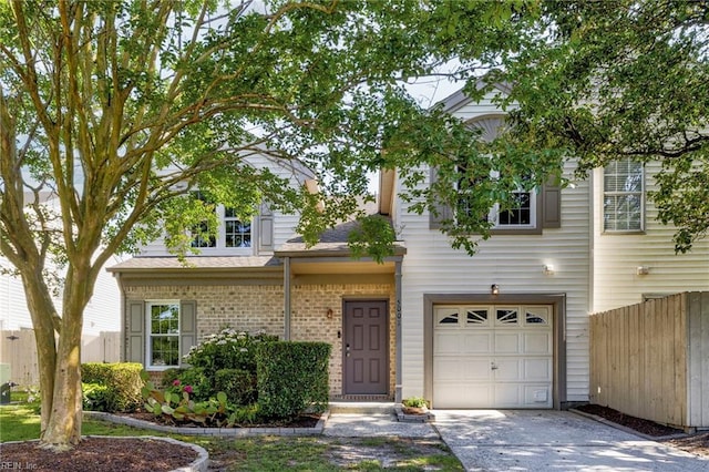 5001 Heathglen Cir, Virginia Beach, VA 23456 - view of front of home featuring a garage, driveway, and brick siding