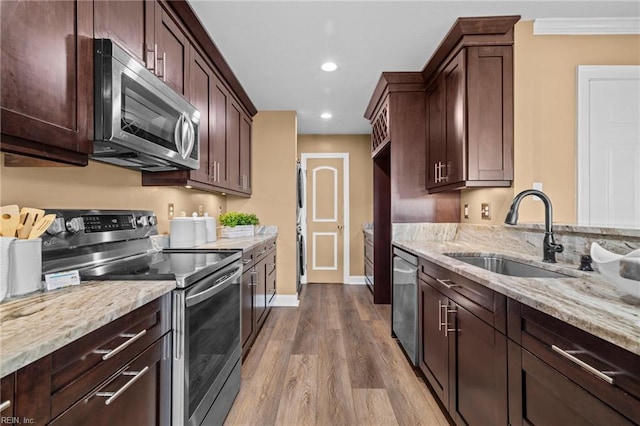 5001 Heathglen Cir, Virginia Beach, VA 23456 - kitchen with appliances with stainless steel finishes, light stone countertops, dark wood-type flooring, dark brown cabinetry, and recessed lighting