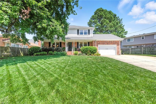 4704 Haygood Point Rd, Virginia Beach, VA 23455 - traditional home featuring brick siding, an attached garage, a porch, and concrete driveway