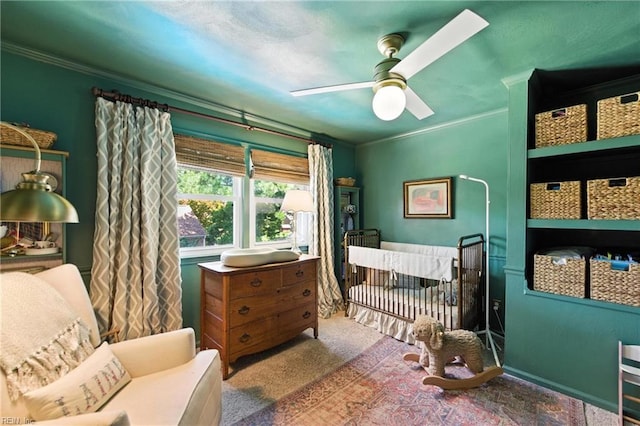 4704 Haygood Point Rd, Virginia Beach, VA 23455 - carpeted bedroom featuring ornamental molding, a ceiling fan, and a nursery area