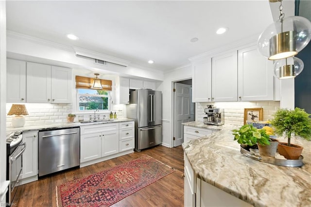 4704 Haygood Point Rd, Virginia Beach, VA 23455 - kitchen with stainless steel appliances, ornamental molding, white cabinets, backsplash, and recessed lighting