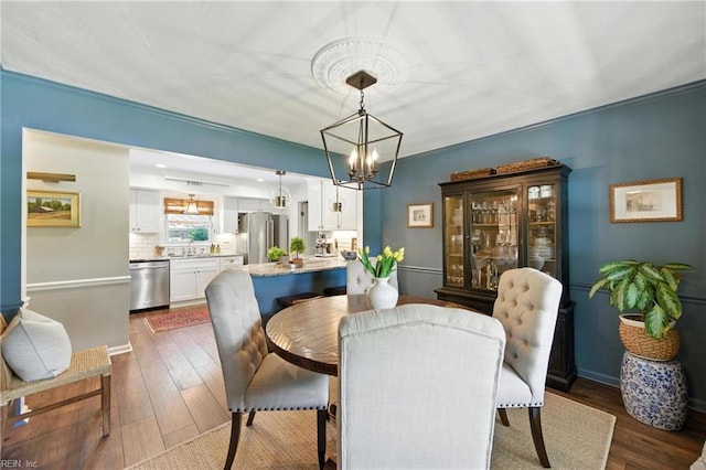 4704 Haygood Point Rd, Virginia Beach, VA 23455 - dining room with dark wood-style flooring and a chandelier
