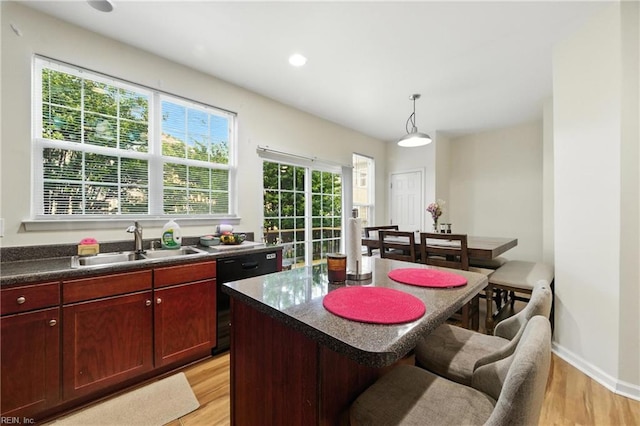 622 Jessica Cir Unit 21, Newport News, VA 23606 - kitchen with dishwasher, dark countertops, light wood finished floors, a kitchen bar, and recessed lighting